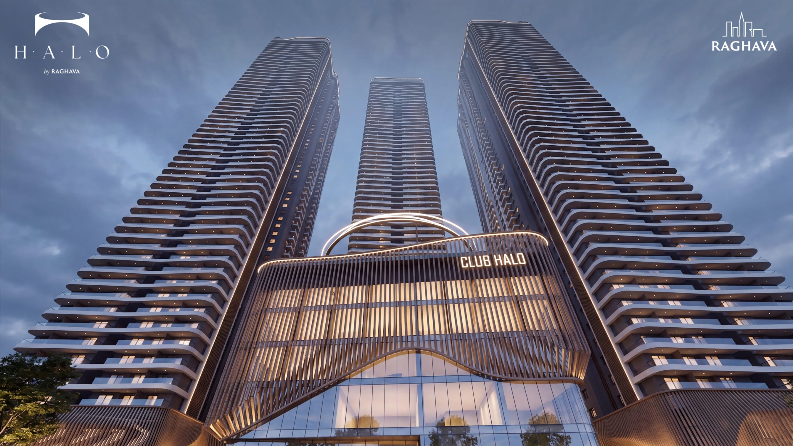 Raghava Halo — looking up at the RERA-approved 3 BHK towers, illuminated at dusk in Kondapur, near HCU, Hyderabad